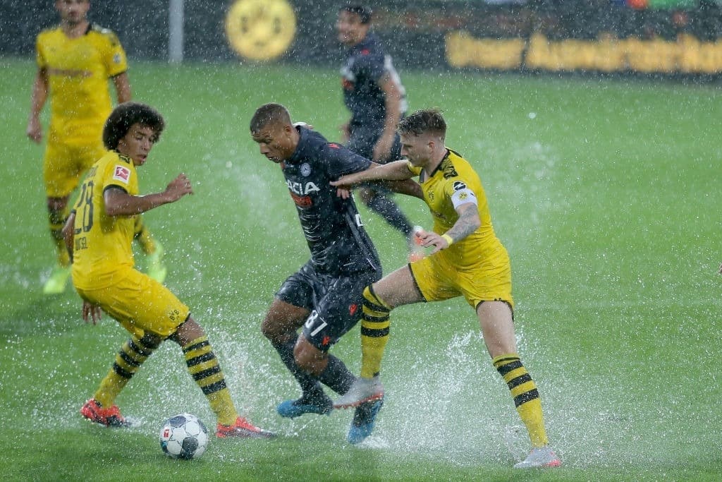 ALTACH, AUSTRIA - JULY 27: Axel Witsel of Borussia Dortmund, Sebastien De Maio of Udinese Calcio and Marco Reus of Borussia Dortmund battle for the ball during the pre-season friendly match between Udinese Calcio and Borussia Dortmund at Cashpoint Arena on July 27, 2019 in Altach, Austria. (Photo by TF-Images/Getty Images)
