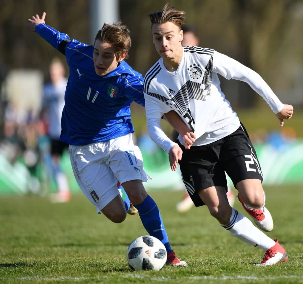 BIBERACH, GERMANY - MARCH 24: Edoardo Bove of Italy and Marvin Obuz of Germany compete for the ball during the International Friendly U16 Germany against U16 Italy at Stadion Adenauerallee Biberach on March 24, 2018 in Biberach, Germany. (Photo by Sebastian Widmann/Bongarts/Getty Images)